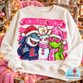 Cream sweatshirt mockup on a chair showing Ole Miss Christmas PNG artwork with a shark, snowman, and pink holiday accents.